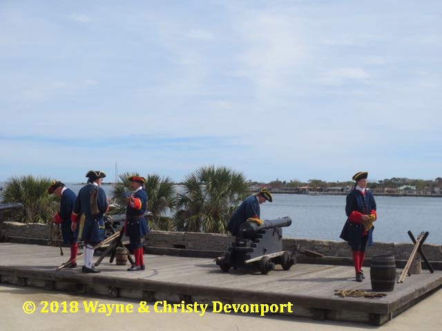 Spanish solders preparing to fire the cannon