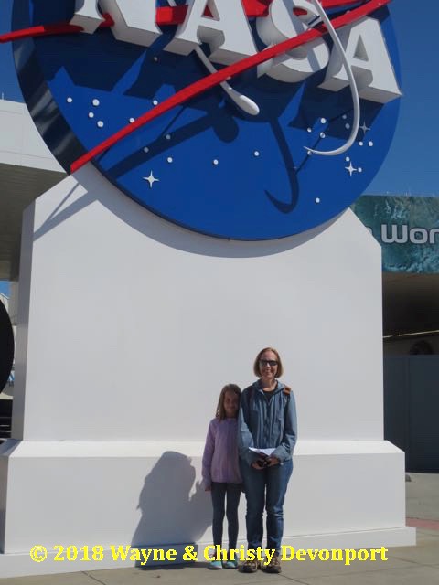 Denali and Christy underneath the NASA meatball