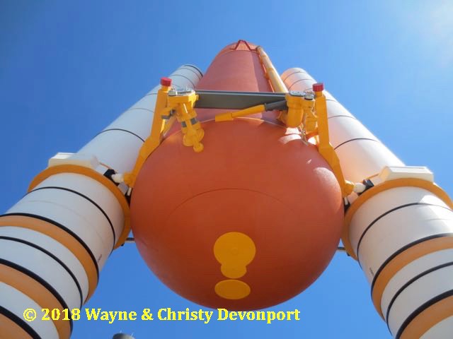 Underneath space shuttle solid rocket boosters and fuel tank