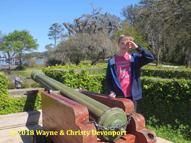 Colby with a cannon at Fort Caroline